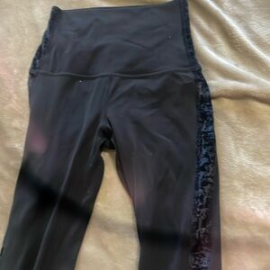 These legging are black and have a felt like texture on both sides of the pants.